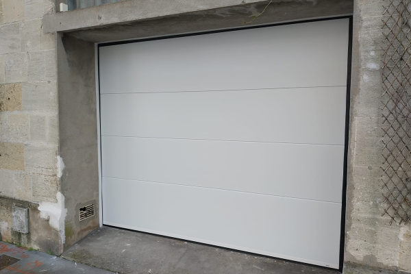  - <p>Porte de garage sectionnelle</p>